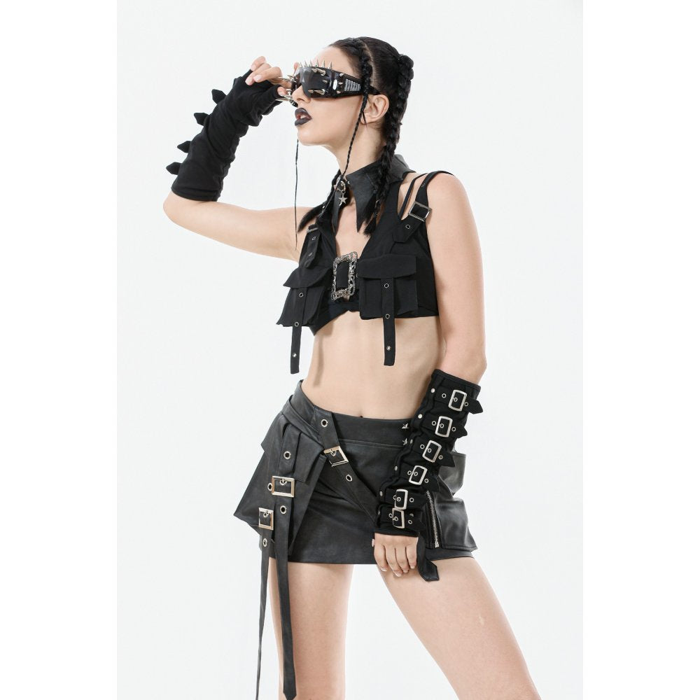 The Dark In Love Evangeline Buckled Utility Crop Top styled with high-waisted trousers, exemplifying contemporary gothic fashion with its structured fit and tactical layering.
