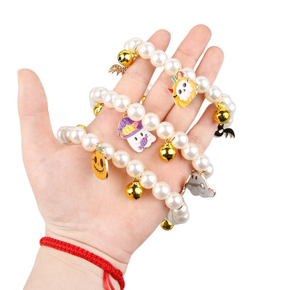 Luxury Pet Pearl Necklace Decoration Halloween Cat Collar featuring charming charms in a hand, showcasing a stylish design for feline friends.