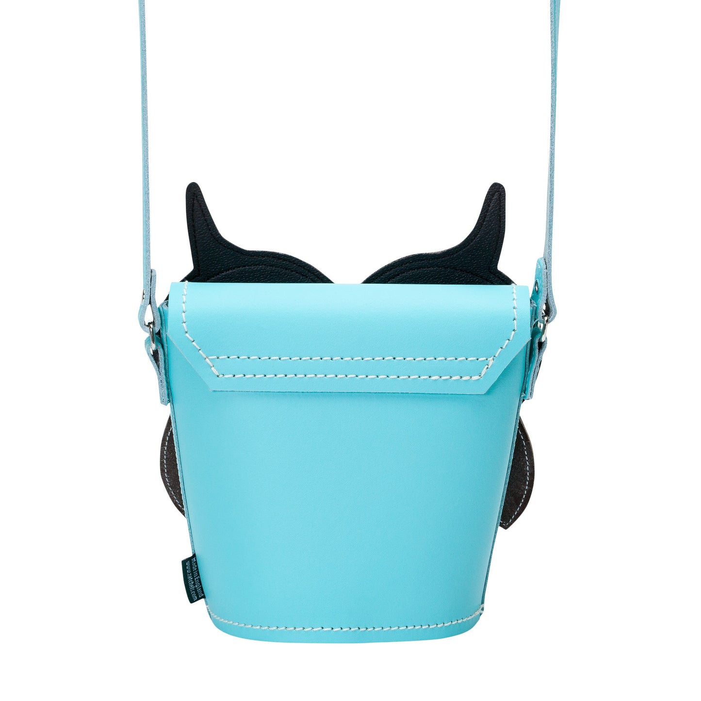 Close-up of the exquisite appliquéd leather face of the Farley Owl Barrel Bag, demonstrating meticulous hand stitching and attention to detail in English leather craftsmanship.