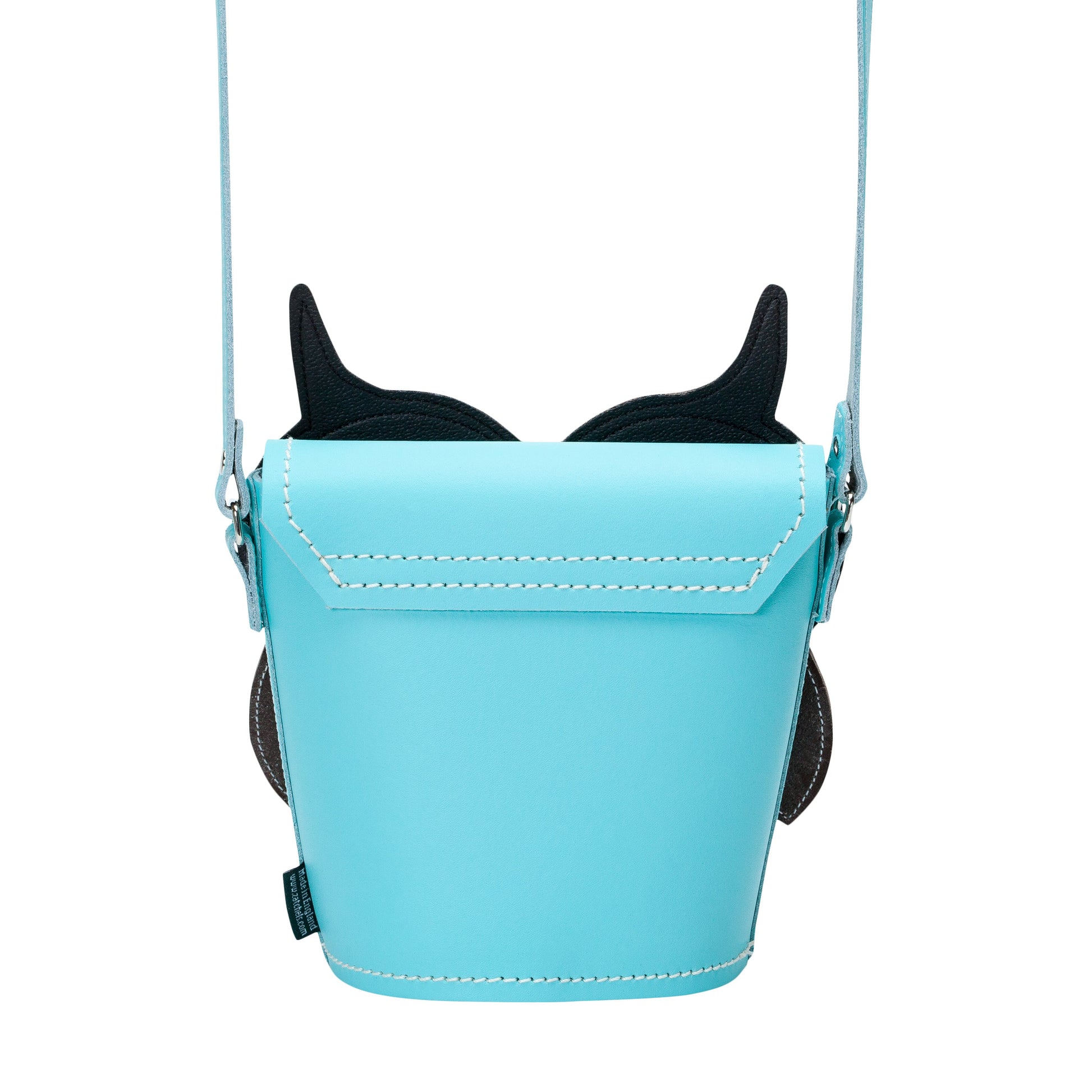 Close-up of the exquisite appliquéd leather face of the Farley Owl Barrel Bag, demonstrating meticulous hand stitching and attention to detail in English leather craftsmanship.