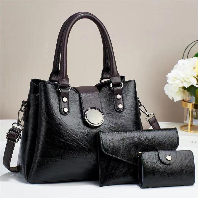 Elegant faux leather shoulder handbag set featuring a pouch and wallet in luxurious black, perfect for stylish modern women.