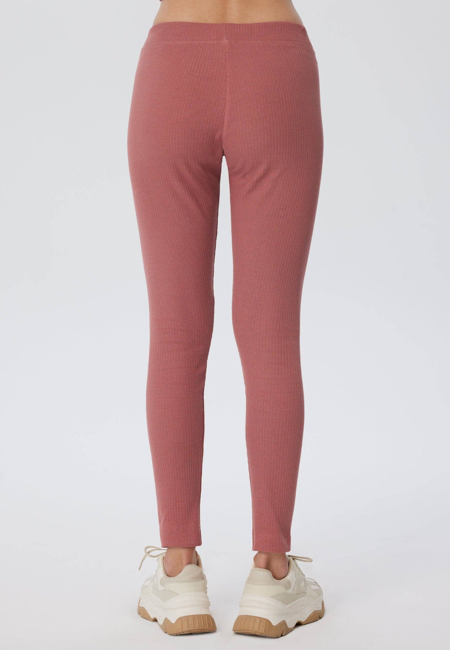 Close-up view of luxurious ribbed texture on organic cotton leggings for women, showcasing the premium quality fabric.