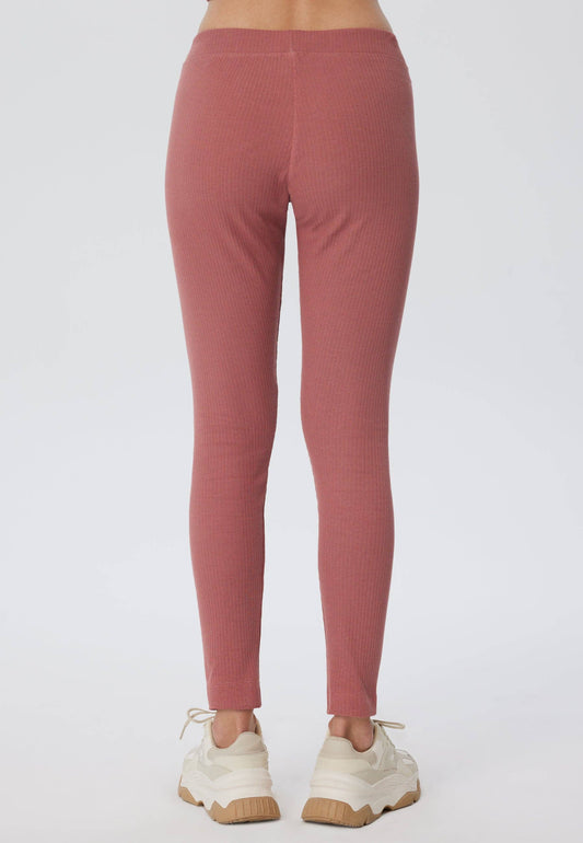 Close-up view of luxurious ribbed texture on organic cotton leggings for women, showcasing the premium quality fabric.