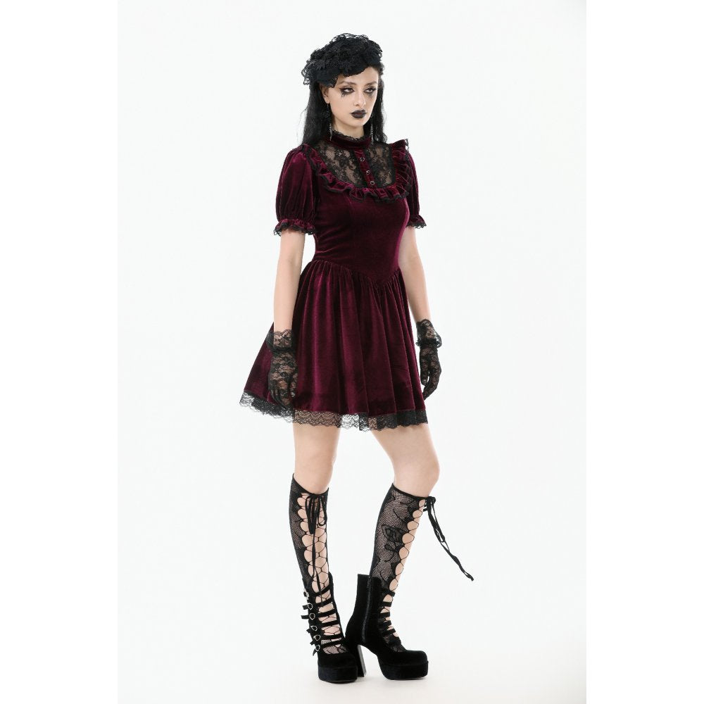 Flared skirt with black lace trim and ruffle detailing, exemplifying gothic romance in a beautifully crafted burgundy velvet dress.