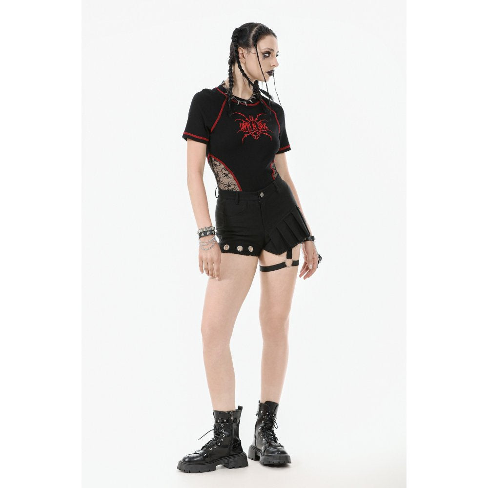 Close-up view of the luxurious pleated asymmetrical design of black garter shorts, featuring detailed silver grommet embellishments that enhance the punk-inspired silhouette.