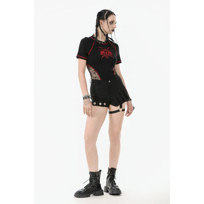 Close-up view of the luxurious pleated asymmetrical design of black garter shorts, featuring detailed silver grommet embellishments that enhance the punk-inspired silhouette.
