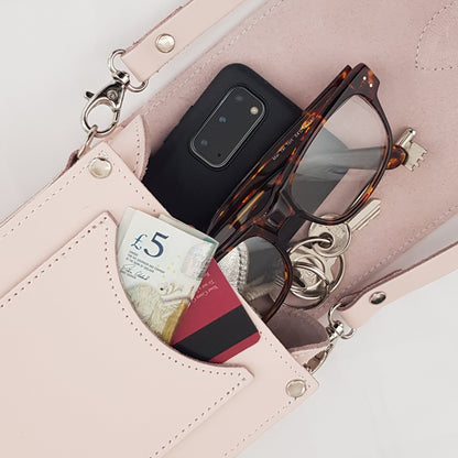 Detailed view of the magnetic closure and stylish buckle of the Handmade Cherry Blossom Leather Festival Phone Bag, highlighting exquisite design and craftsmanship.