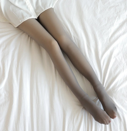 Luxury Women's Padded Tights perfectly styled on a bed, depicting an alluring grey shade suitable for both active and leisure occasions.