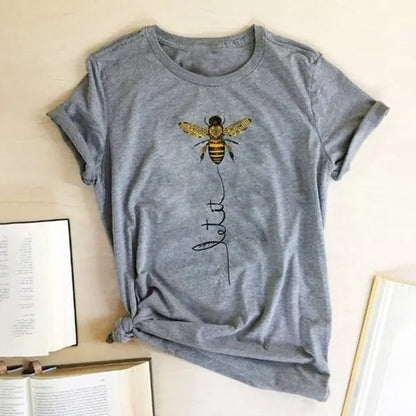 Close-up of the luxurious fabric of the Bee Kind Women's Graphic Tee by Dazzling Dreams Studio, highlighting the soft cotton blend that offers a gentle touch on the skin.
