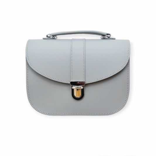 Luxurious Olympia Handmade Leather Handbag in Ghost Grey, showcasing British craftsmanship and customisation options. Perfectly sized at 22.5cm x 16cm for essential everyday carry.