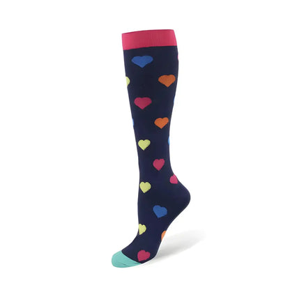 Women's Knee Length Compression Travel Socks for Comfort, Style, and Circulation featuring a chic navy base with vibrant heart motifs, blending elegance and comfort.