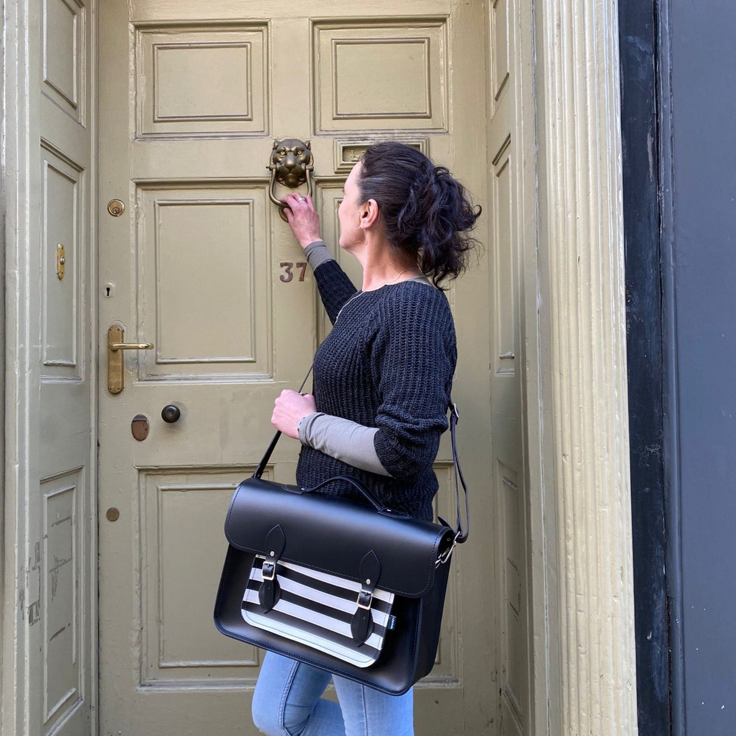 Elegant Gothic Striped Handmade Leather Satchel in black and white, showcasing artisanal craftsmanship and stylish design, ideal for luxury fashion lovers.
