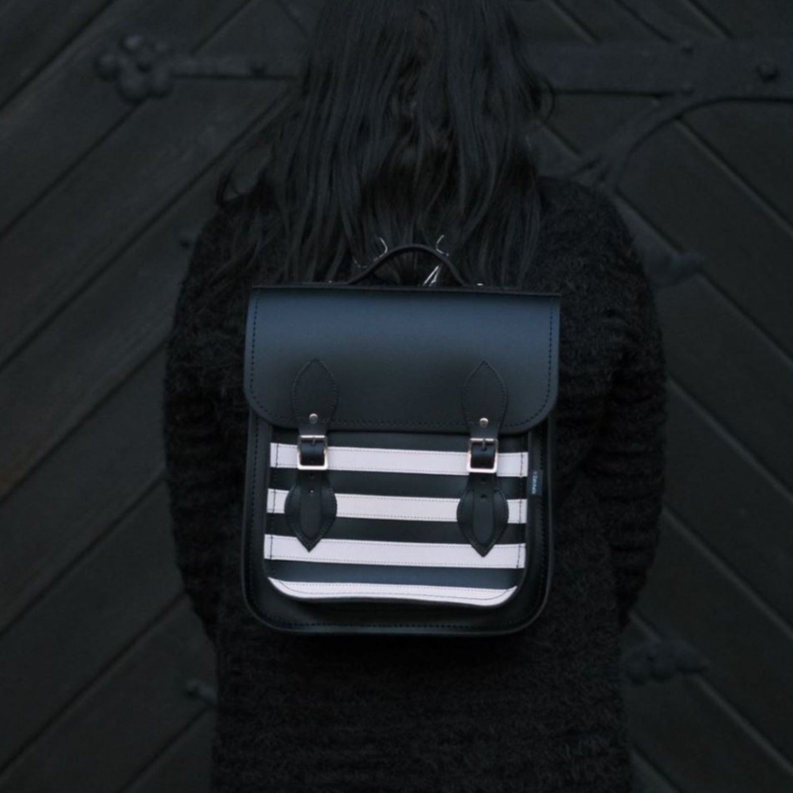 Handmade Gothic Leather City Backpack in striking black and white stripes, perfect for modern urbanites, showcasing premium craftsmanship and versatility for carrying laptops and tablets.