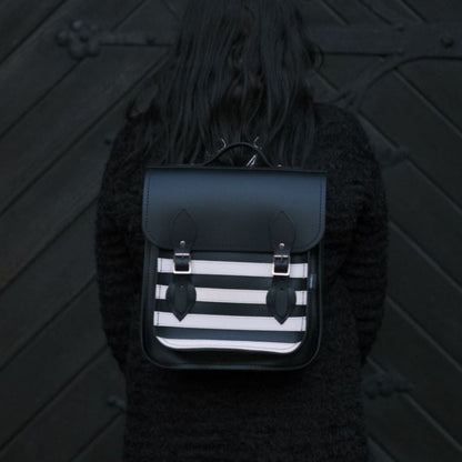 Handmade Gothic Leather City Backpack in striking black and white stripes, perfect for modern urbanites, showcasing premium craftsmanship and versatility for carrying laptops and tablets.