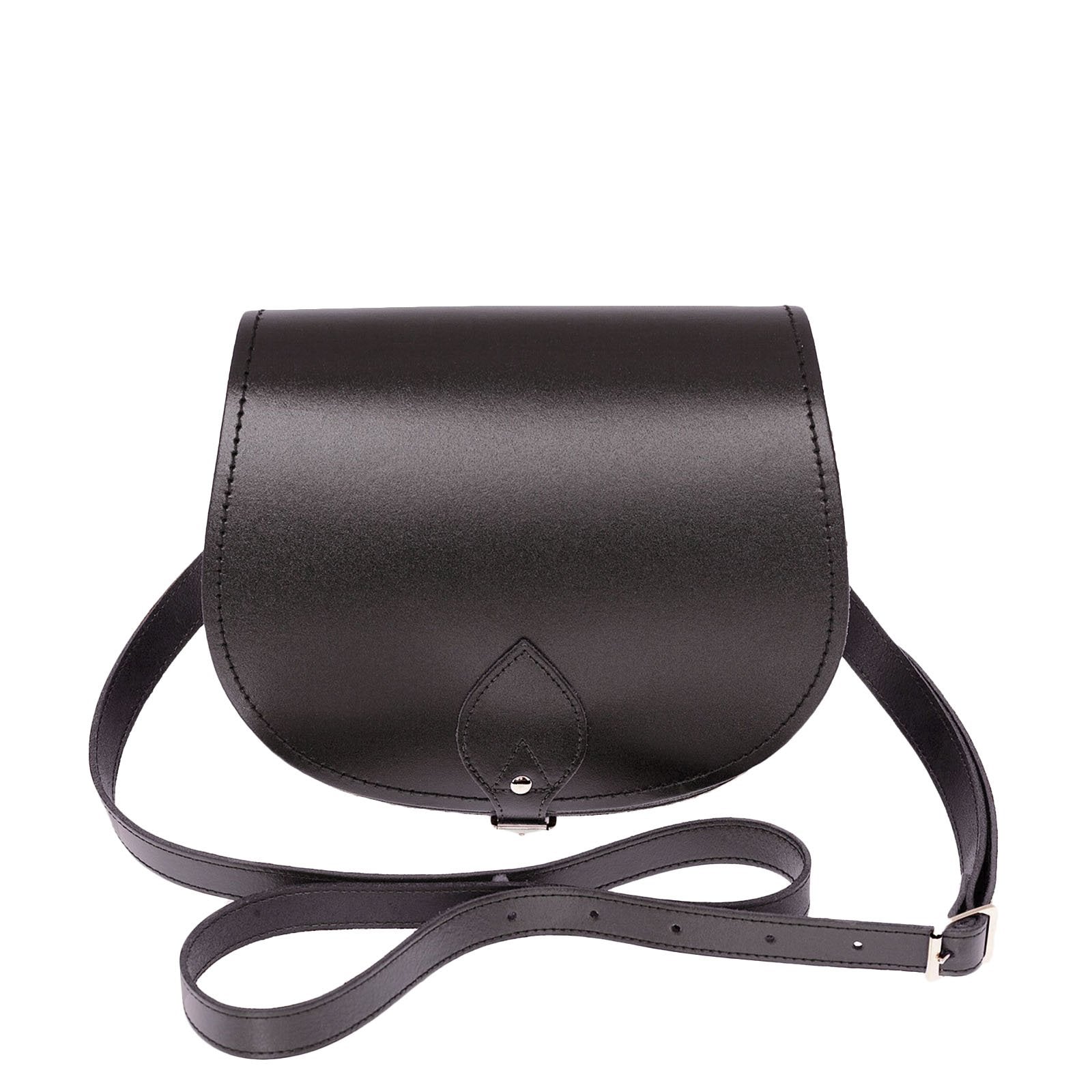 Handmade Graphite Leather Saddle Bag by Zatchels, showcasing its elegant classic design, adjustable crossbody strap, and luxurious leather craftsmanship, available in two sizes.