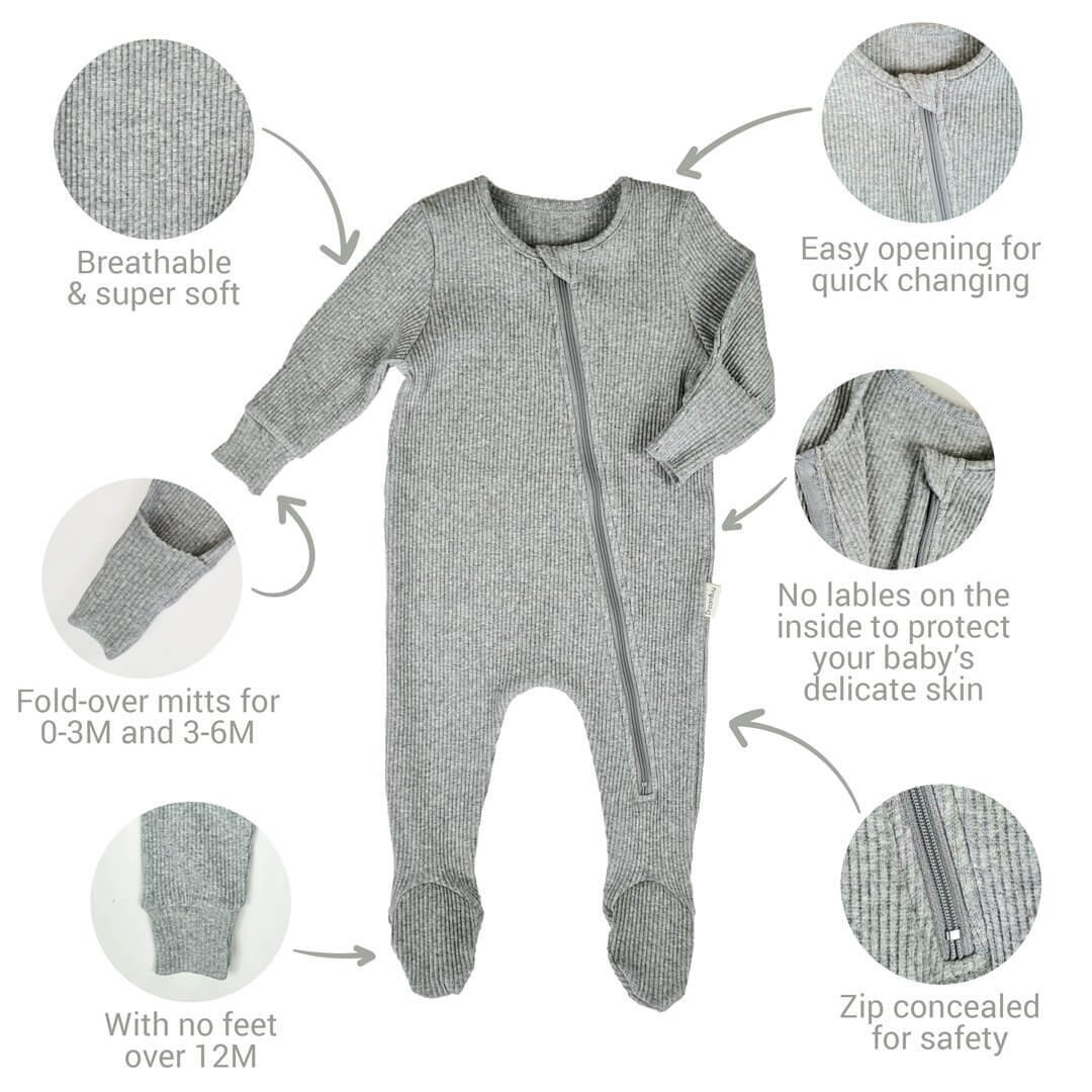 DreamBuy Sweet Pink Zip Sleepsuit styled with accessories, making a delightful gift option for baby showers or birthdays.