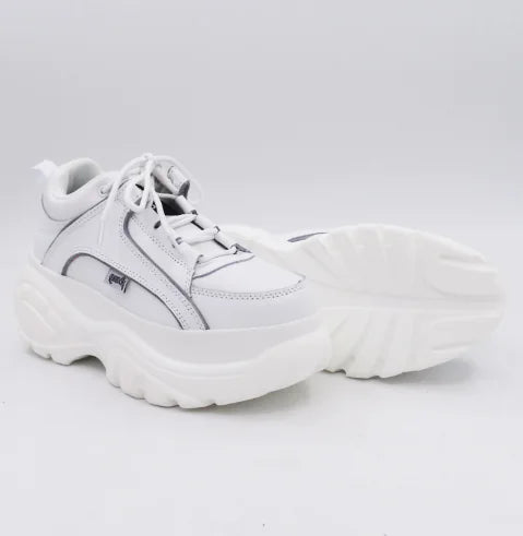 Sleek white sneaker with a modern design, emphasizing both luxury and practicality for everyday wear.
