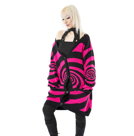 Elegant Vixxsin oversized black and hot pink Hypno cardigan featuring bold swirl knit design, perfect for making a fashion statement.