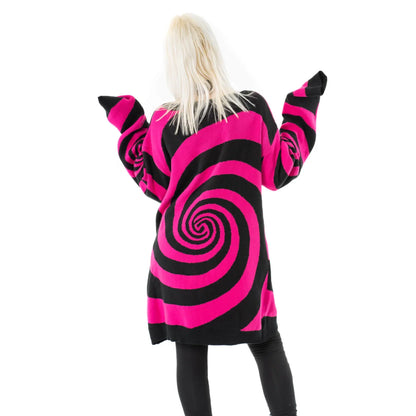 Close-up of the luxurious Vixxsin Hypno cardigan showcasing intricate black and hot pink swirl knit pattern and stylish button-up front.