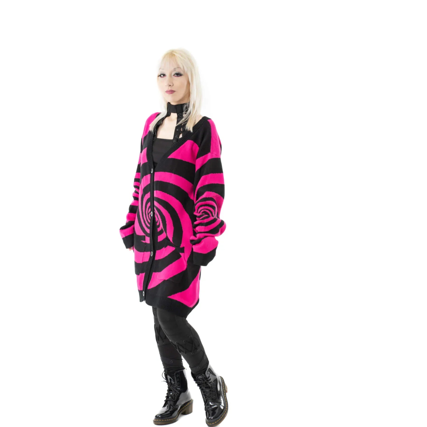 Close-up view of the Vixxsin oversized cardigan featuring a striking black and hot pink pattern, ideal for chic layering.