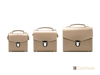 Luxurious Handmade Iced Coffee Leather Sugarcube Handbag captured in a chic setting, highlighting its trendy shape and refined details.