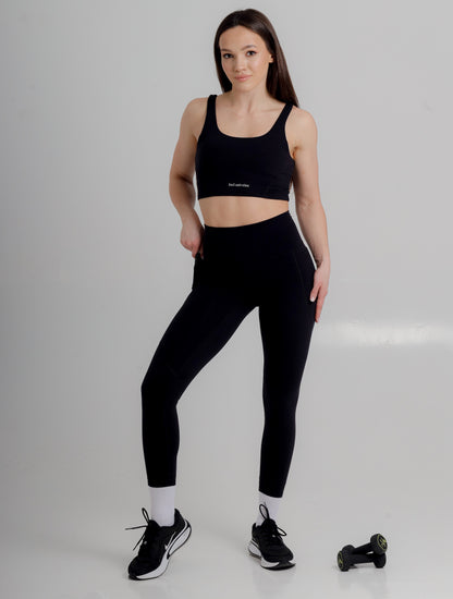 Luxurious black high-waist leggings with pockets from Incl.usiveinc, designed for performance and style, ideal for gym and casual wear.