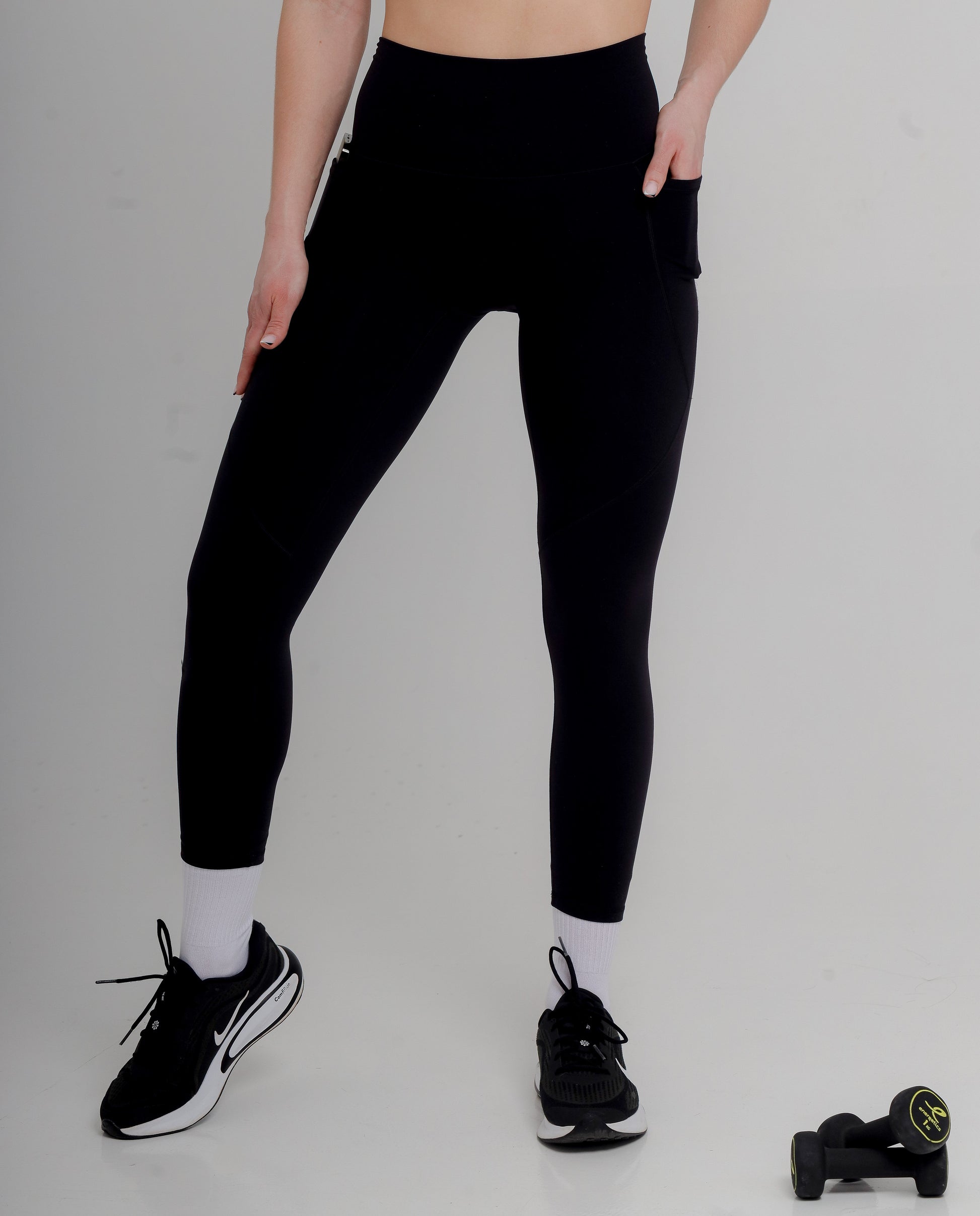 Premium Active Black Leggings by Incl.usiveinc with high waist fit and functional side pockets, showcasing a luxurious design for comfort and performance during workouts.