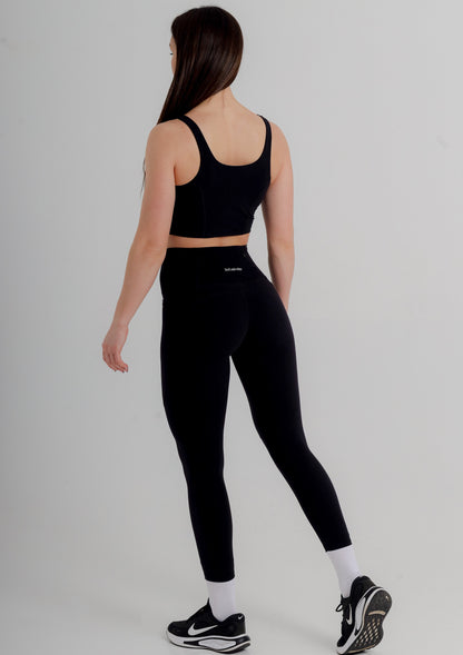 Model demonstrating the sculpting fit of Incl.usiveinc's Premium Active Black Leggings, ideal for both gym and casual wear.