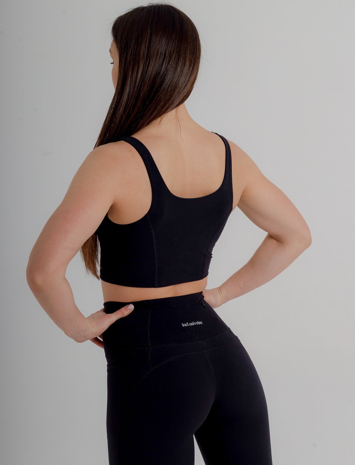 Stylish black leggings by Incl.usiveinc, crafted from high-quality stretchy fabric for gym training and everyday elegance.
