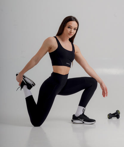 Sleek Premium Active Black Leggings by Incl.usiveinc featuring a high waist fit and functional side pockets, perfect for workouts.