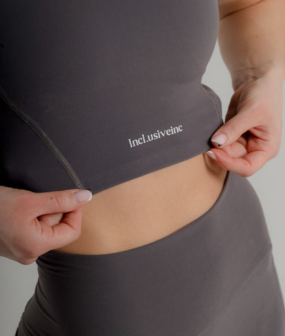 Stylish Active Grey Sports Bra by Incl.usiveinc, showcasing high support and sweat-wicking fabric, designed for luxury fitness enthusiasts.