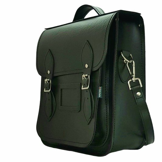 Stunning interior of the Zatchels Handmade Leather City Backpack, highlighting sophisticated black lining and robust silver nickel buckles for a luxurious touch.
