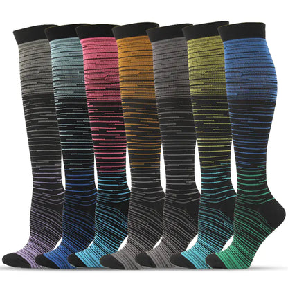 A luxurious display of Men's and Women's activewear Flightwear Compression Stockings and Socks in a variety of gradient colours, showcasing their stylish and sophisticated design for athletic performance.