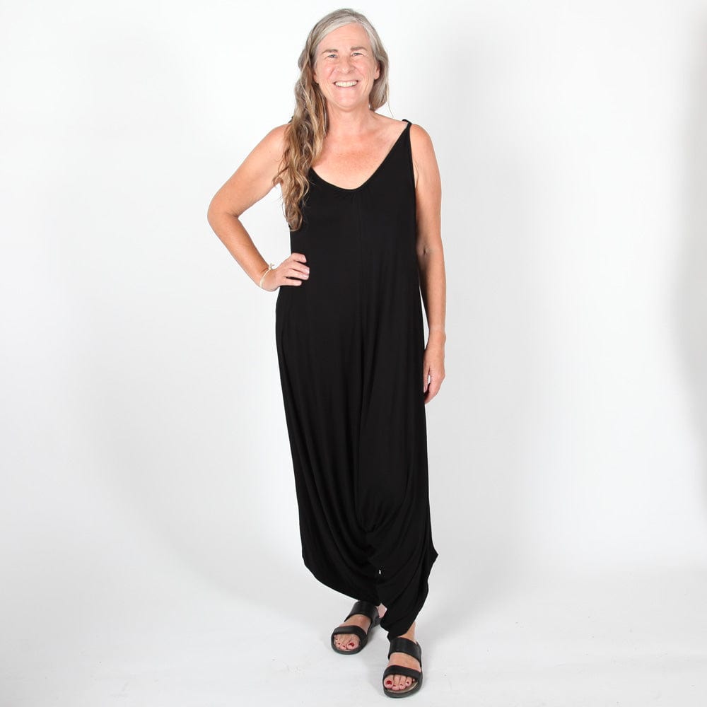 Chic green harem jumpsuit made from soft, flowing fabric with stretch, designed for a comfortable yet sophisticated fit.