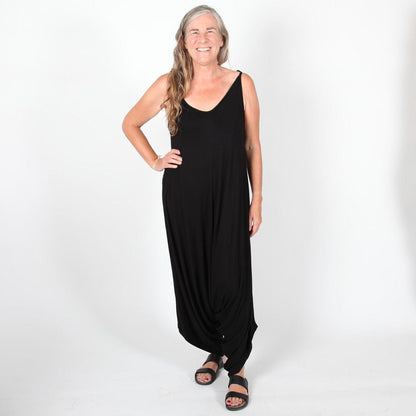 Chic green harem jumpsuit made from soft, flowing fabric with stretch, designed for a comfortable yet sophisticated fit.