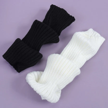 Luxury Long Socks Women's Leg Warmers in black and white, highlighting the chic ribbed design, perfect for adding warmth and style.