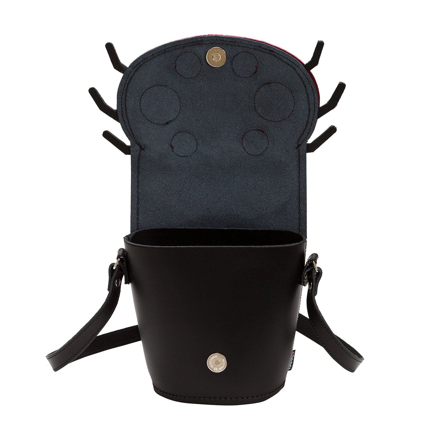 Stylish Luna Ladybird Handmade Leather Barrel Bag shown in a chic outdoor setting, demonstrating its versatility as a fashionable accessory for any occasion.