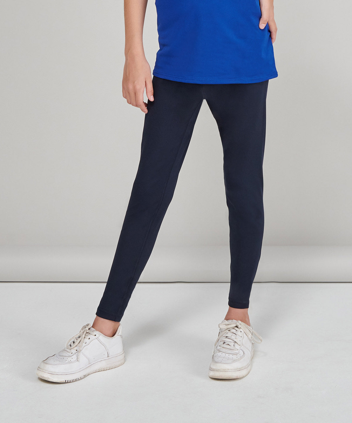 Luxury high-waisted stretch leggings for kids crafted from 80% recycled polyester, featuring a comfortable fit and stylish design.