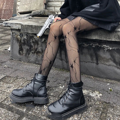 Chic Women's Luxury Fishnet Design Tights paired with stylish black boots, exuding edgy elegance.