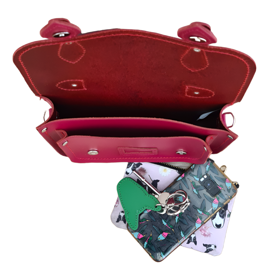 Luxurious Handmade Leather Midi Satchel in vibrant magenta, showcasing expert craftsmanship and stylish design with adjustable strap and nickel silver buckles.