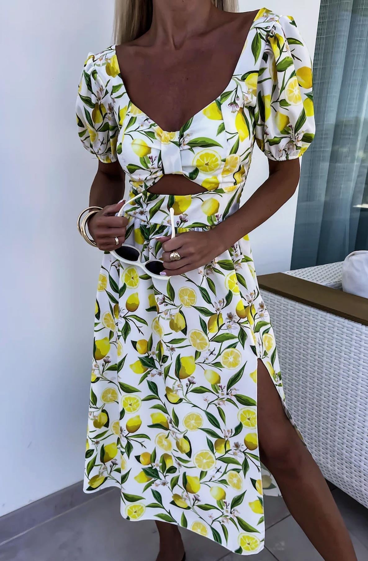 Chic Cut-Out Midriff and Breathable Side Slits of the Zesty Lemon Midi Dress, ideal for warm-weather wear.