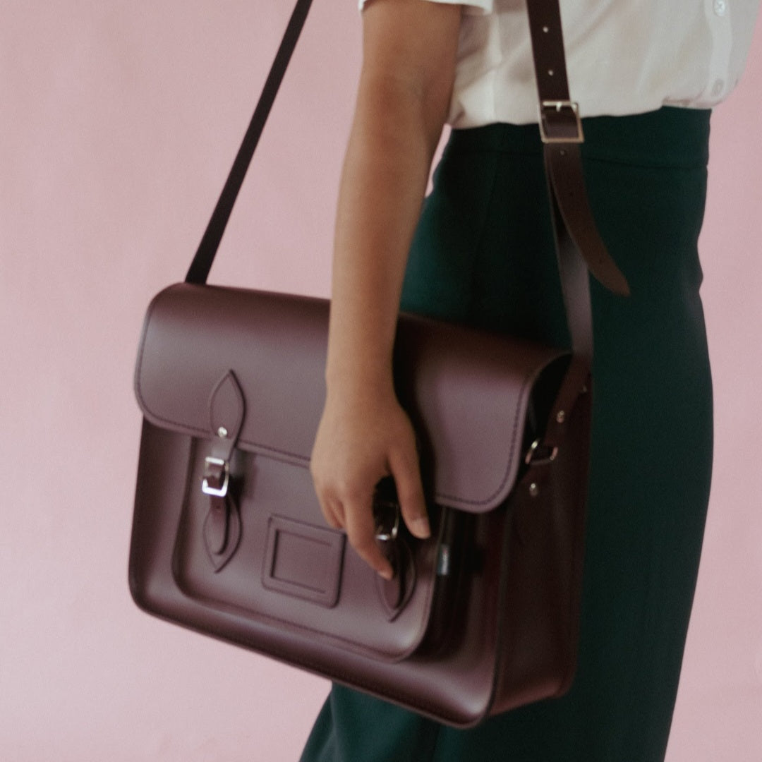 Versatile Marsala Red Leather Satchel styled as a chic cross-body bag, elegantly designed for both men and women, perfect for everyday use.