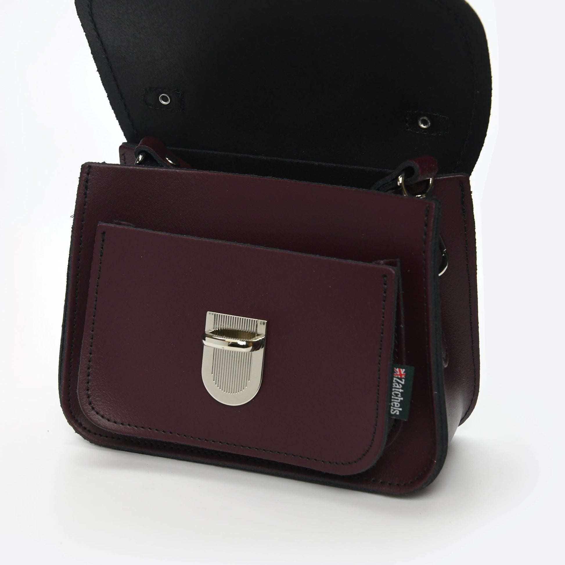 Luna Marsala Red Handmade Leather Bag showcasing luxurious craftsmanship with a push-lock clasp and adjustable strap, perfect for stylish occasions.