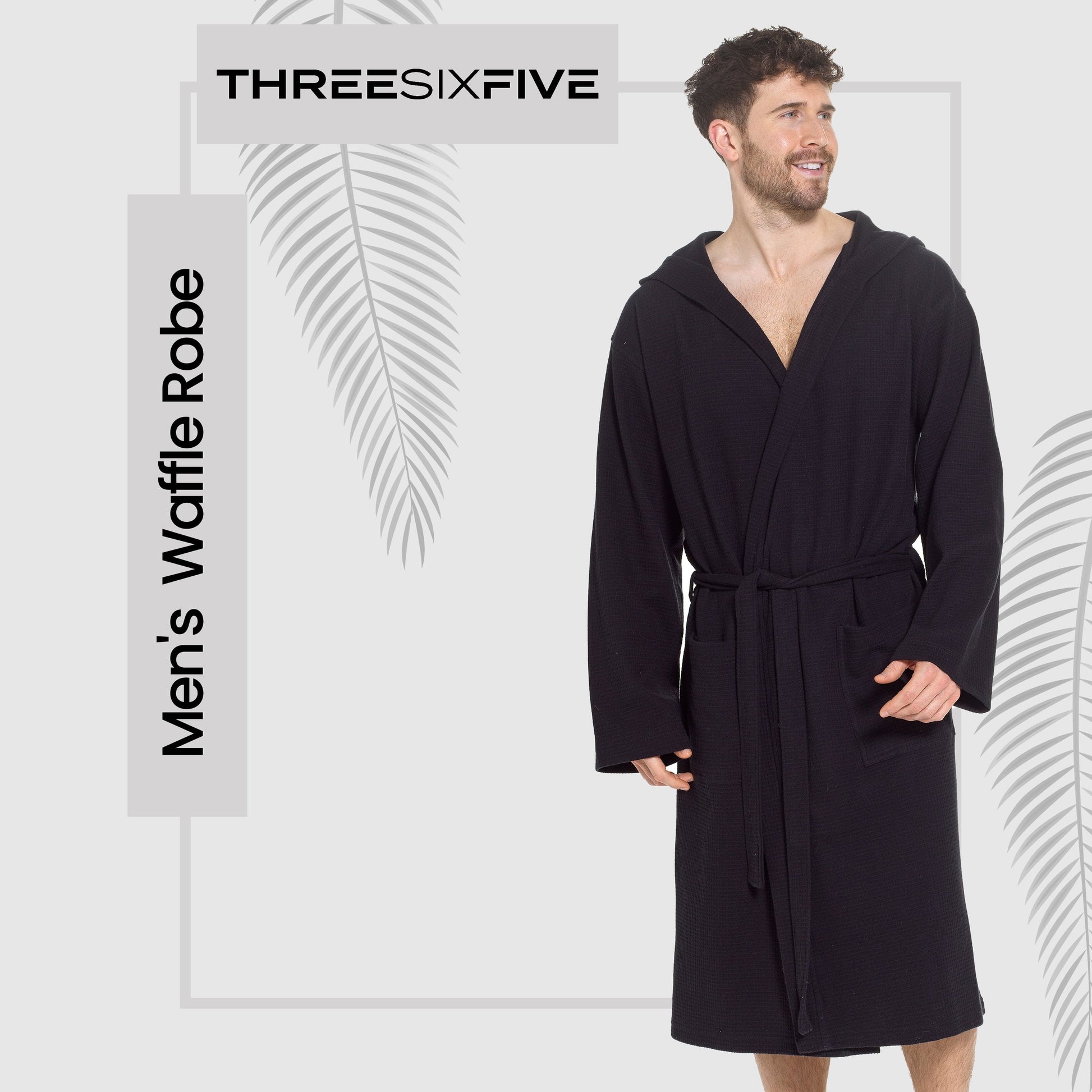 Stylish luxury men's hooded bathrobe laid out to highlight its adjustable front tie belt and cozy hood, combining elegance with practicality in black cotton.