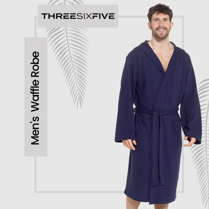 Stylish Men's Hooded Navy Cotton Bathrobe displayed in a serene spa setting, highlighting its luxurious features and perfect fit for relaxation.
