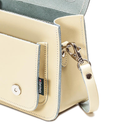 Interior view of Zatchels Handmade Leather Micro Satchel, highlighting spacious design for essentials including larger smartphones, showcasing practicality and sophistication.