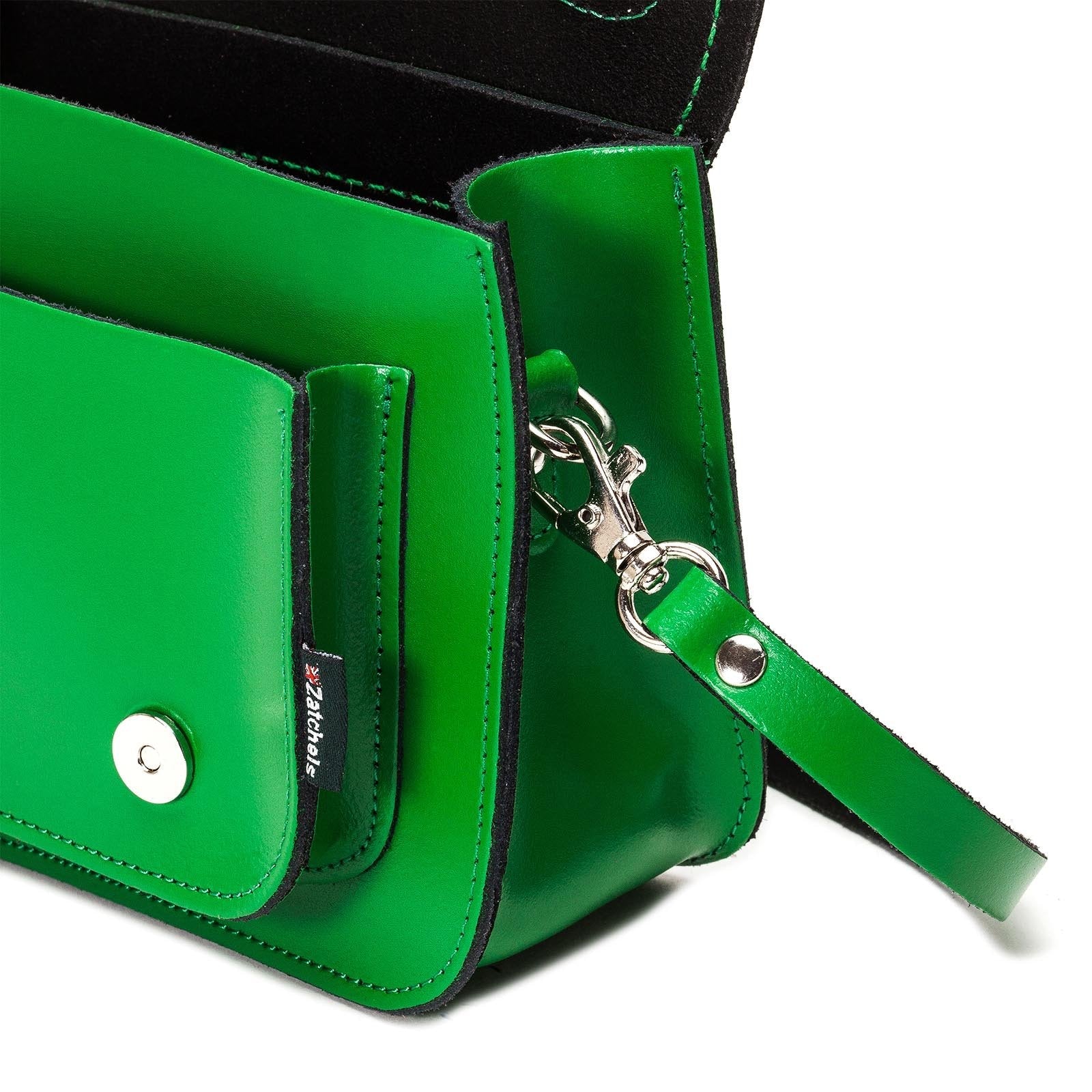 Stylish Handmade Green Leather Micro Satchel displayed in a fashionable setting, perfect for complementing any outfit with its vibrant colour and classic design.