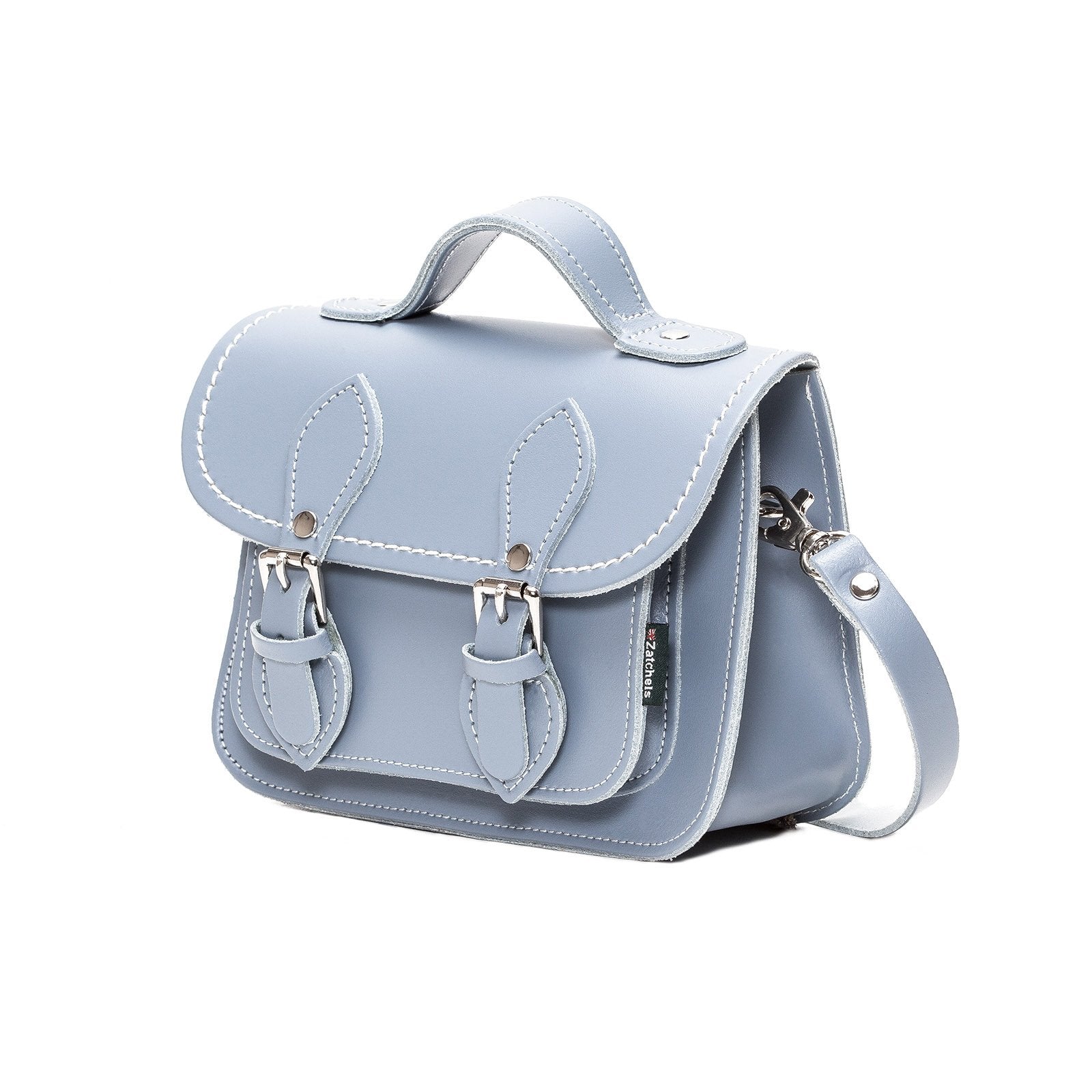 Stylishly displayed Handmade Leather Micro Satchel in Lilac Grey with adjustable strap, perfect for versatile fashion styling.