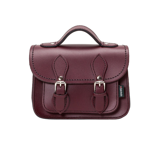 Handmade Marsala Red Leather Micro Satchel showcasing premium craftsmanship with intricate matching stitching and nickel silver buckles.