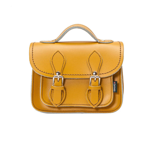 Handmade Yellow Ochre Leather Micro Satchel displayed elegantly on a model, showcasing its exquisite craftsmanship and stylish design, perfect for luxury fashion enthusiasts.